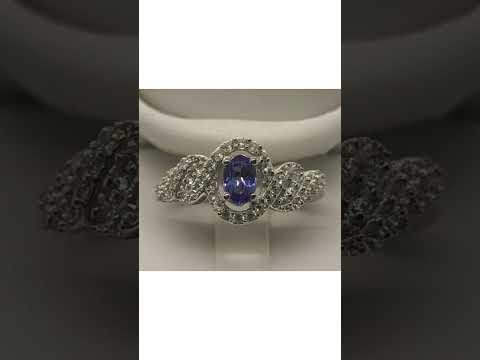 5009 AAA Tanzanite and White Zircon Ring